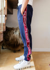  Men's and women's premium cotton fleece jogging bottoms with long leg and cuffed ankles in navy and burgundy. 